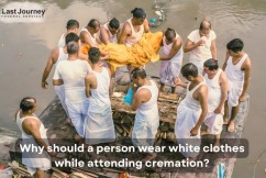 Why should a person wear white clothes while attending or performing cremation